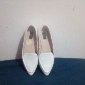 All white leather summery dress shoes for young women or young girl.